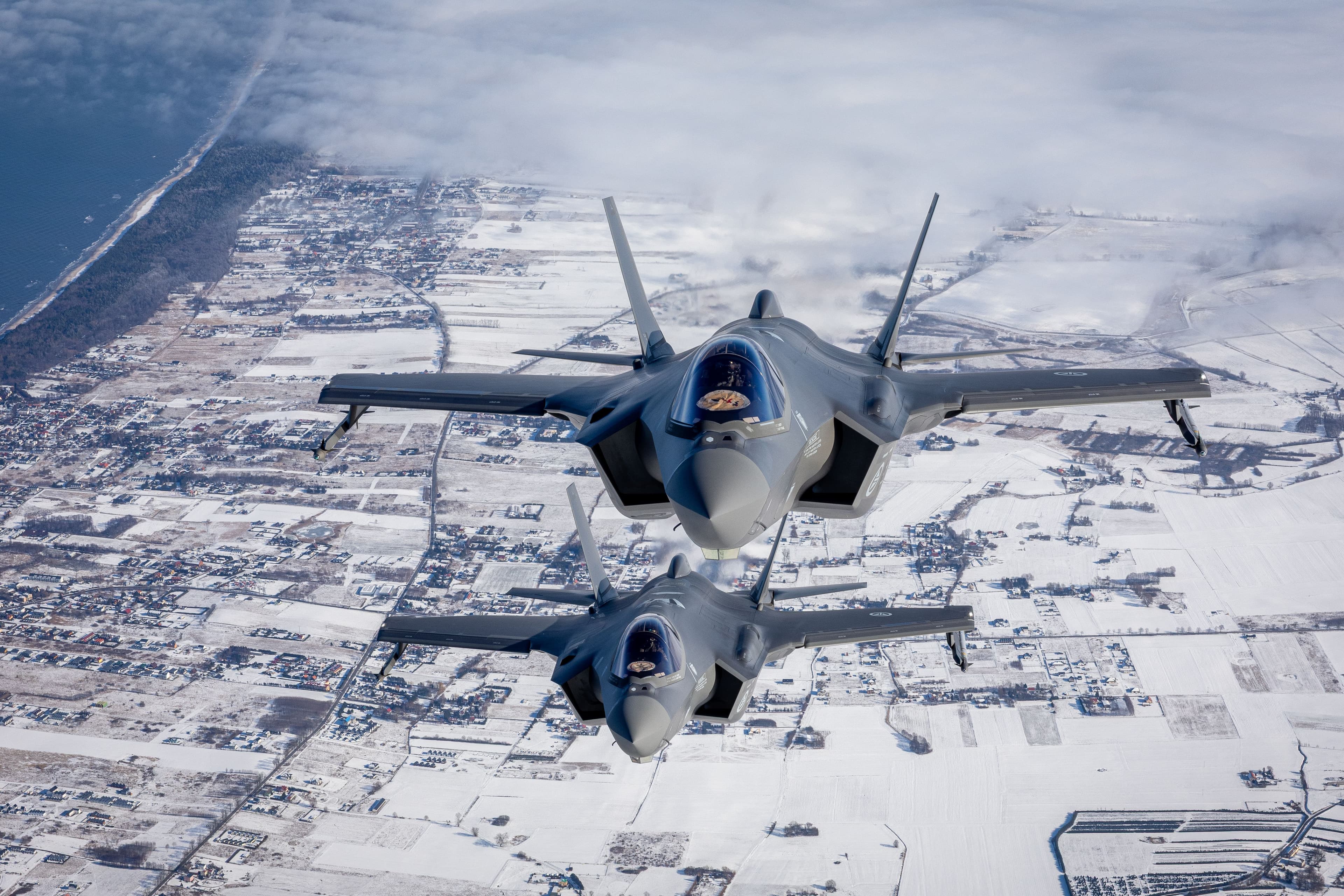 Two jet plains in snowy terrain